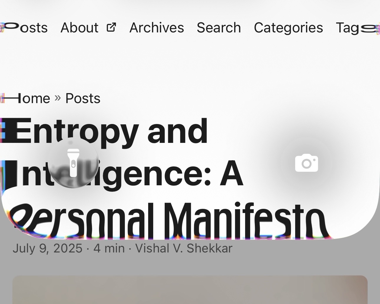 Screenshot of an iPhone running iOS 26 showing the new glass interface effect with chromatic aberration. The blurred overlay with rainbow fringes distorts part of a blog page titled ‘Entropy and Intelligence: A Personal Manifesto’ by Vishal V. Shekkar. The glass panel also displays iOS controls like a flashlight and camera shortcut, emphasizing the colorful edge refraction effect.